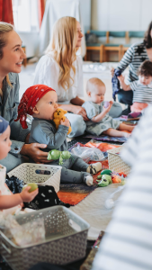 when do babies start playing with other babies?