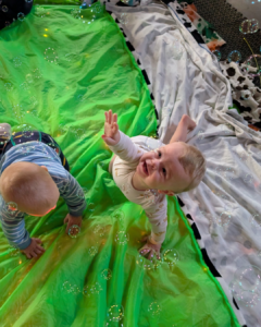 When do babies interact with each other 