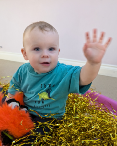 when do babies start pointing and waving