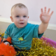 when do babies start pointing and waving