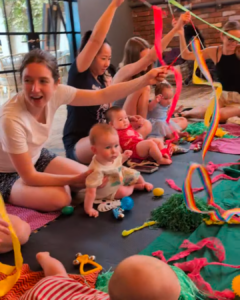 when do babies play with other babies