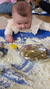 how to encourage my baby to reach and roll