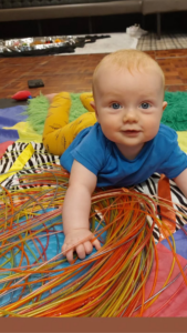 how to encourage my baby to reach and roll