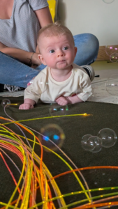 how to encourage my baby to reach and roll