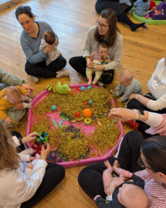 when do babies play with other babies