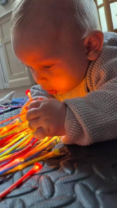how to encourage my baby to reach and roll