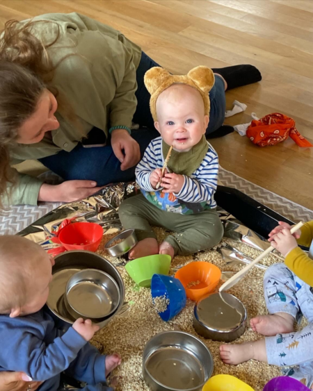 when do babies play with other babies